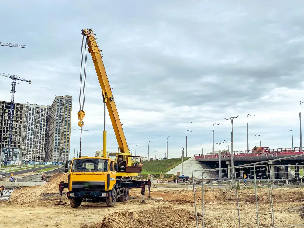 Mobile crane lifting equipment at a construction site